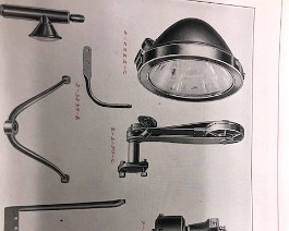 Horn, headlight, and headlight bracket as seen in a factory sales brochure.